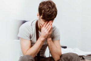 a man struggles to cope with the symptoms of his drug withdrawal