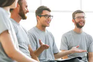 individuals receive peer support in group therapy in cocaine addiction treatment