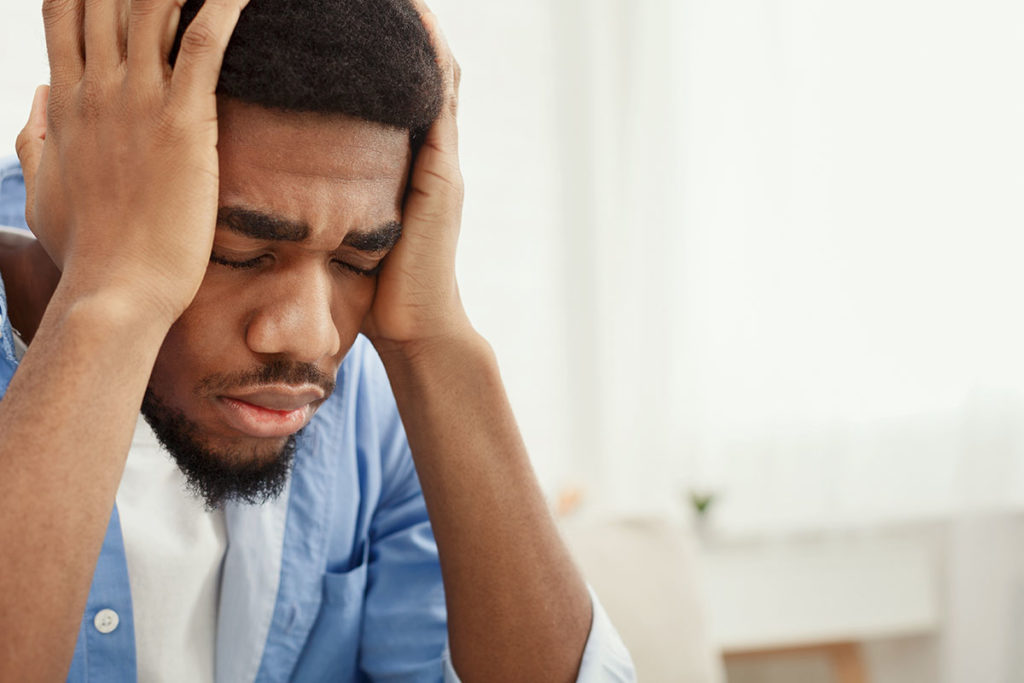 a man struggles with his mental health due to depression