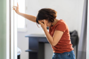 a woman struggles through heroin withdrawal without professional help trying not to relapse