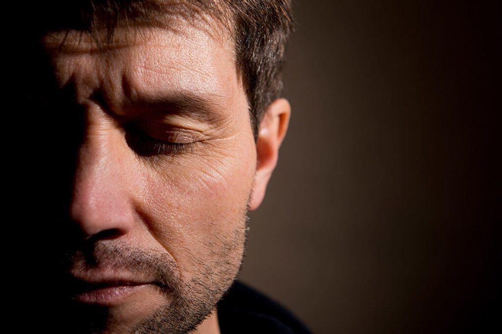 a man struggles to cope with his ptsd triggers and considers seeking professional help