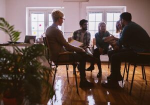 members meet for group therapy in prescription drug rehab 