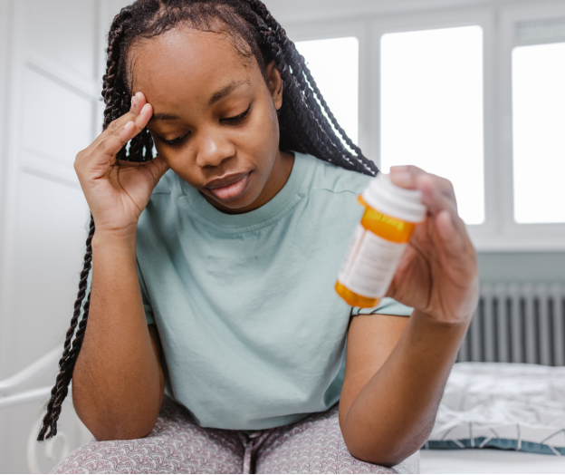 a woman takes suboxone for opioid addiction